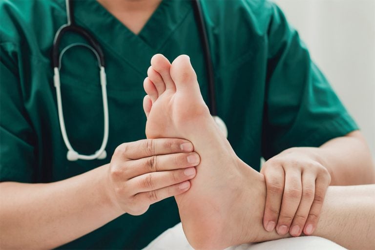 Podiatrist Treating Foot
